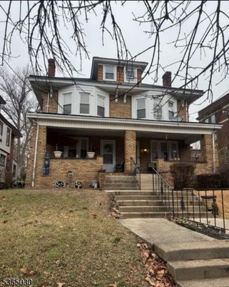 Exterior, Facade, Brick Facade, American Foursquare