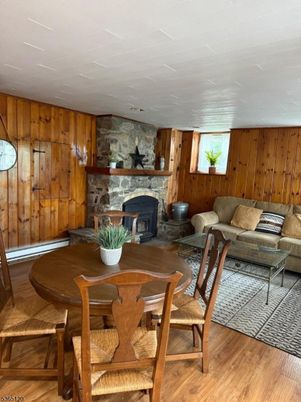 Dining room, Fireplace, Interior, Living room, Stone Walls, Wood Texture Flooring, Wooden Walls
