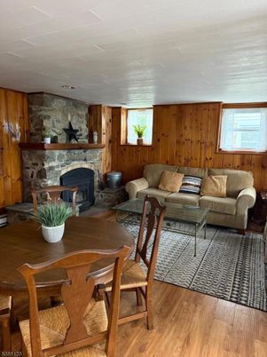 Dining room, Fireplace, Interior, Living room, Stone Walls, Wood Texture Flooring, Wooden Walls