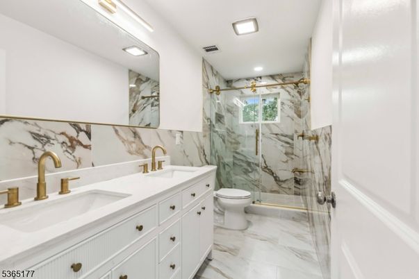 Bathroom, Dual Sink Vanities, Glass Shower, Interior, Marble, Marble Walls, Recessed Lighting