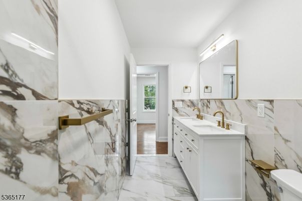 Bathroom, Dual Sink Vanities, Interior, Marble, Marble Walls, Wood Texture Flooring
