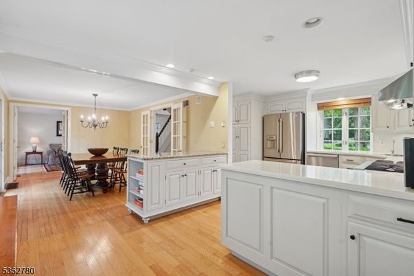 Chandelier, Dining room, Interior, Kitchen, Recessed Lighting, Stainless Steel Appliances, Wood Texture Flooring