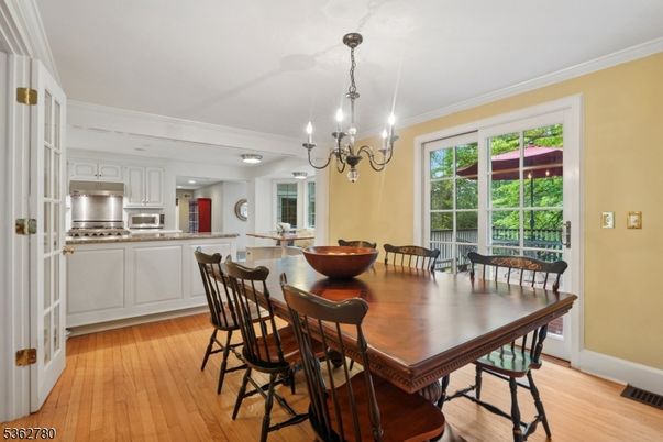 Chandelier, Dining room, Interior, Kitchen, Stainless Steel Appliances, Wood Texture Flooring