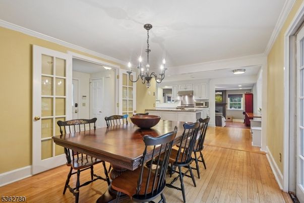 Chandelier, Dining room, Interior, Kitchen, Recessed Lighting, Stainless Steel Appliances, Wood Texture Flooring