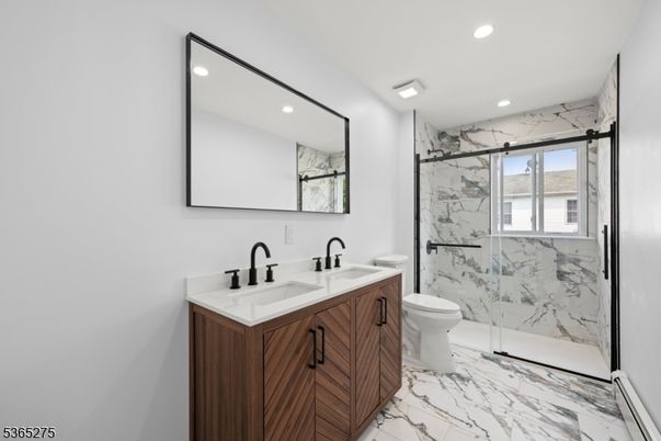 Bathroom, Dual Sink Vanities, Glass Shower, Interior, Marble, Marble Walls, Recessed Lighting