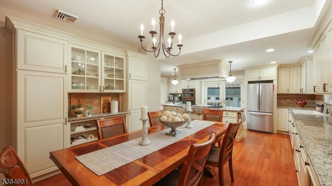 Chandelier, Dining room, Interior, Kitchen, Pendant Lights, Recessed Lighting, Stainless Steel Appliances, Wood Texture Flooring
