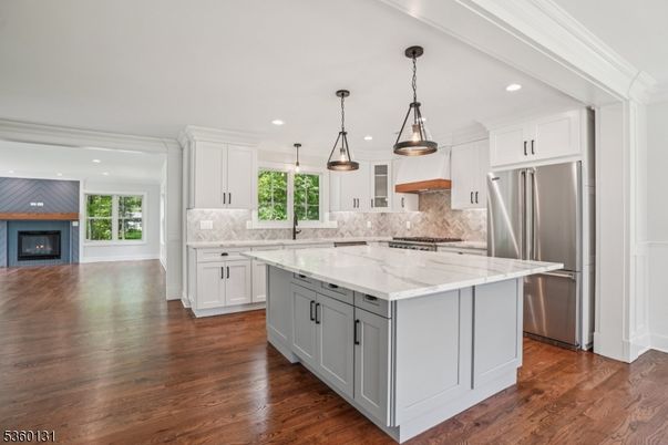 Fireplace, Interior, Kitchen, Pendant Lights, Recessed Lighting, Stainless Steel Appliances, Wood Texture Flooring