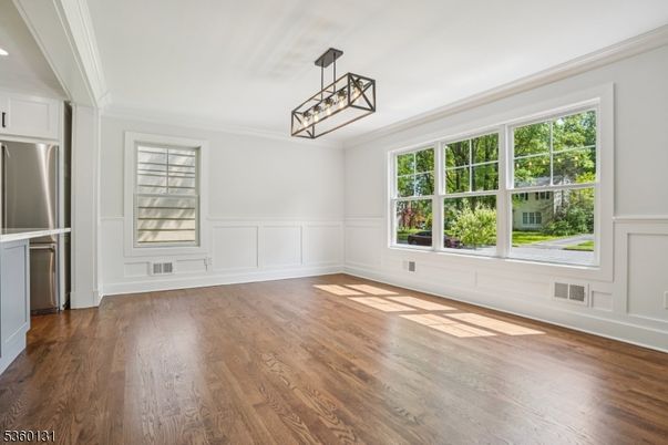 Empty room, Interior, Pendant Lights, Recessed Lighting, Stainless Steel Appliances, Wood Texture Flooring