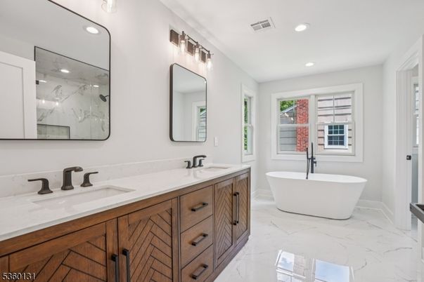 Bathroom, Dual Sink Vanities, Free Standing Baths, Interior, Marble, Marble Walls, Recessed Lighting