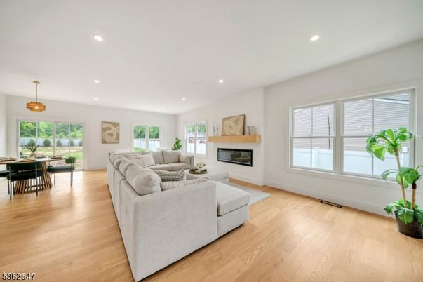 Dining room, Fireplace, Interior, Living room, Pendant Lights, Recessed Lighting, Wood Texture Flooring