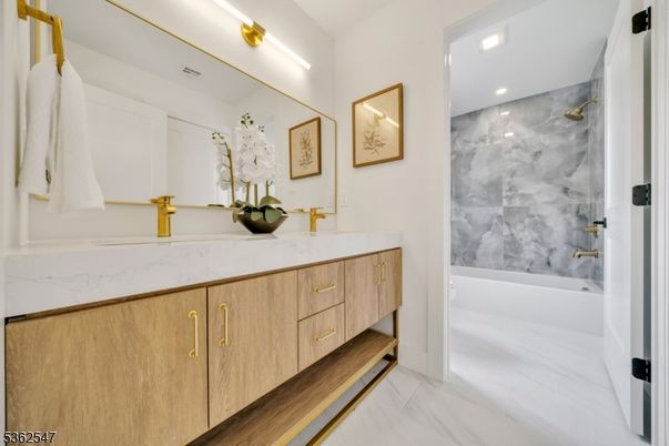 Bathroom, Dual Sink Vanities, Interior, Marble, Marble Walls, Recessed Lighting, Wood Texture Flooring