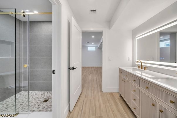 Bathroom, Dual Sink Vanities, Glass Shower, Interior, Recessed Lighting, Wood Texture Flooring
