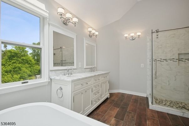Bathroom, Dual Sink Vanities, Glass Shower, Interior, Marble Walls, Wood Texture Flooring