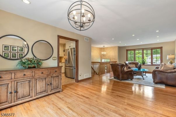 Chandelier, Interior, Kitchen, Living room, Pendant Lights, Recessed Lighting, Stainless Steel Appliances, Wood Texture Flooring