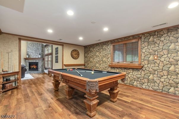 Billiard Table, Fireplace, Game Room, Interior, Recessed Lighting, Stone Walls, Wood Texture Flooring