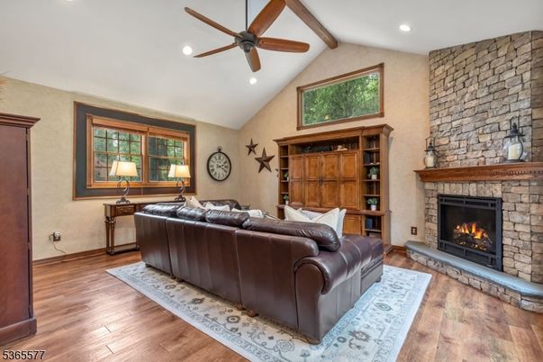 Fireplace, Interior, Living room, Recessed Lighting, Stone Walls, Wood Texture Flooring