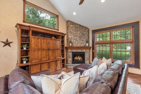Fireplace, Interior, Living room, Recessed Lighting, Stone Walls, Wood Texture Flooring