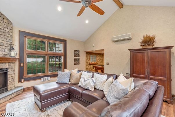 Fireplace, Interior, Living room, Recessed Lighting, Stone Walls, Wooden Beams, Wood Texture Flooring