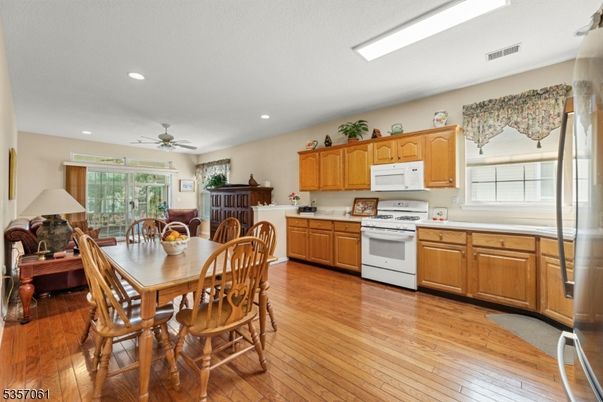 Dining room, Interior, Kitchen, Recessed Lighting, Stainless Steel Appliances, Wood Texture Flooring