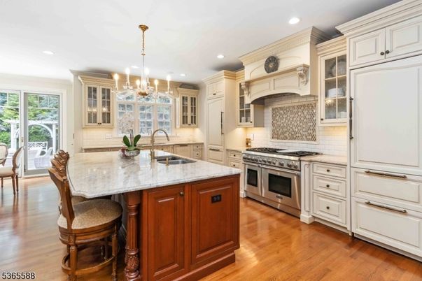 Chandelier, Interior, Kitchen, Pendant Lights, Recessed Lighting, Stainless Steel Appliances, Wood Texture Flooring