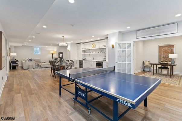 Chandelier, Game Room, Interior, Living room, Pendant Lights, Recessed Lighting, Wood Texture Flooring