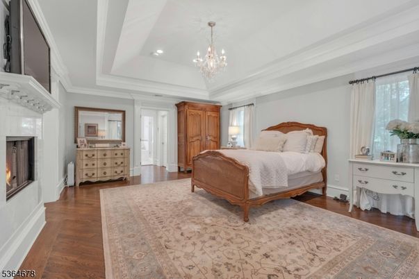 Bedroom, Chandelier, Fireplace, Interior, Recessed Lighting, Wood Texture Flooring