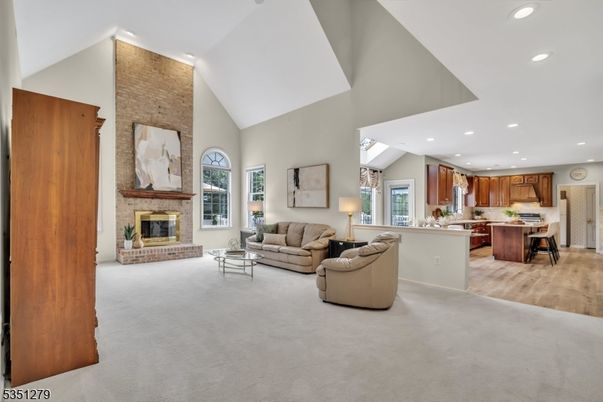 Fireplace, Interior, Kitchen, Living room, Recessed Lighting, Stone Walls, Wood Texture Flooring
