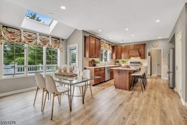 Dining room, Interior, Kitchen, Recessed Lighting, Stainless Steel Appliances, Wood Texture Flooring