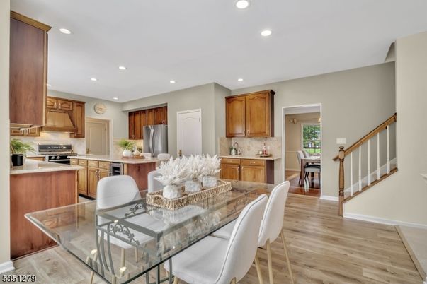 Dining room, Interior, Kitchen, Recessed Lighting, Stainless Steel Appliances, Wood Texture Flooring