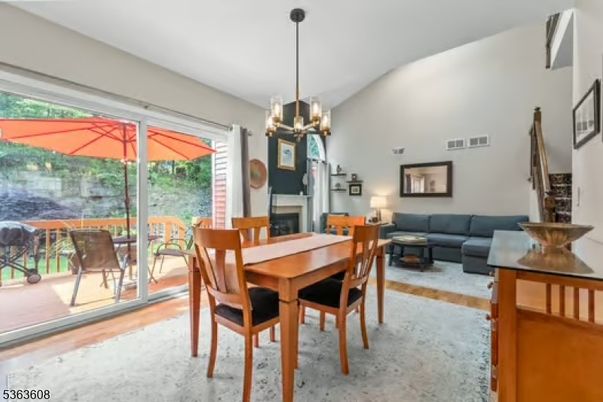 Chandelier, Dining room, Fireplace, Interior, Living room, Pendant Lights, Wood Texture Flooring