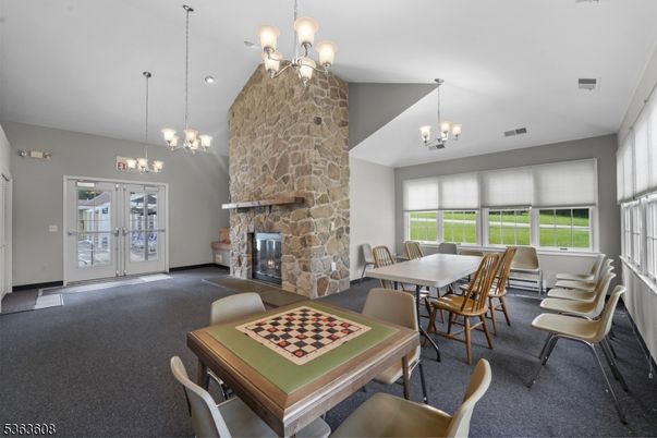 Chandelier, Dining room, Fireplace, Interior, Pendant Lights, Recessed Lighting, Stone Walls