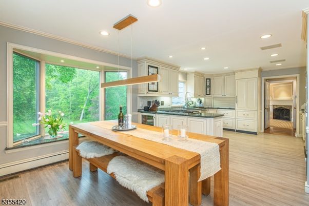 Dining room, Interior, Kitchen, Pendant Lights, Recessed Lighting, Stainless Steel Appliances, Wood Texture Flooring