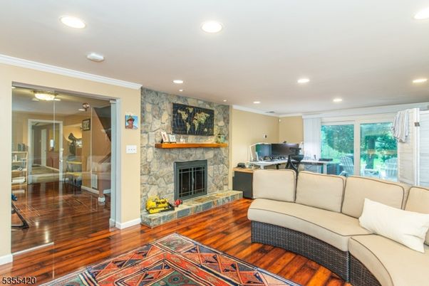 Fireplace, Interior, Living room, Recessed Lighting, Stone Walls, Wood Texture Flooring