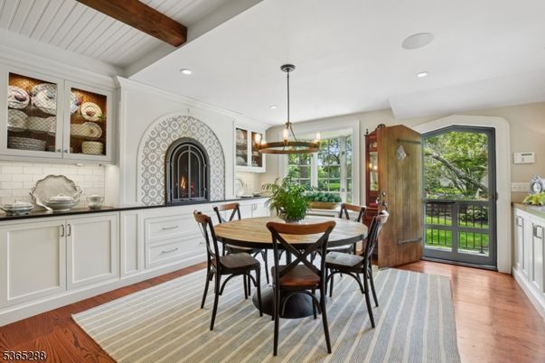Dining room, Fireplace, Interior, Pendant Lights, Recessed Lighting, Wooden Beams, Wood Texture Flooring