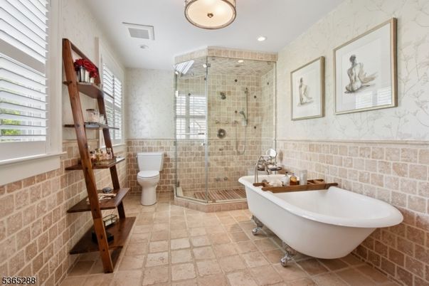 Bathroom, Free Standing Baths, Glass Shower, Interior, Recessed Lighting, Stone Walls