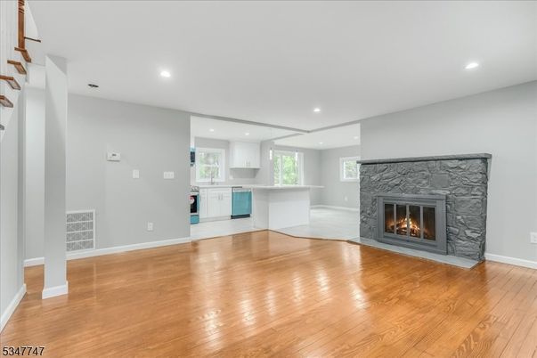 Empty room, Fireplace, Interior, Kitchen, Recessed Lighting, Wood Texture Flooring