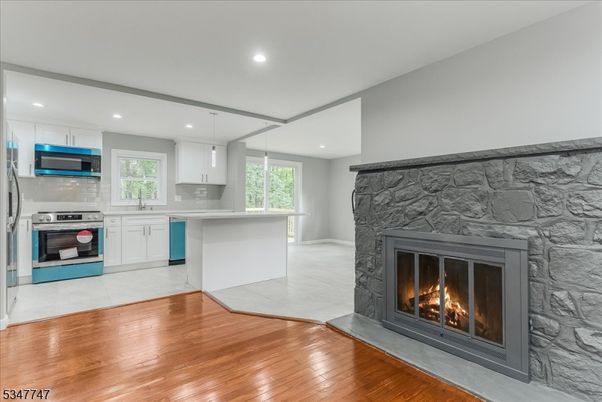 Fireplace, Interior, Kitchen, Pendant Lights, Recessed Lighting, Stainless Steel Appliances, Wood Texture Flooring