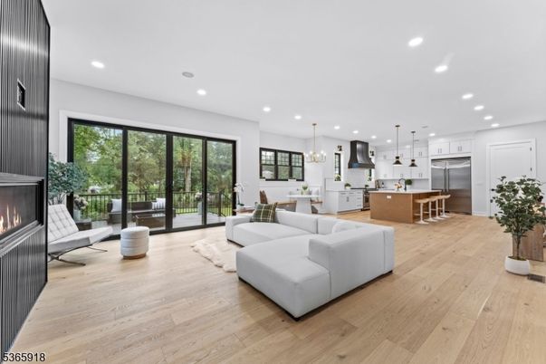 Dining room, Fireplace, Interior, Kitchen, Living room, Pendant Lights, Recessed Lighting, Stainless Steel Appliances, Wood Texture Flooring