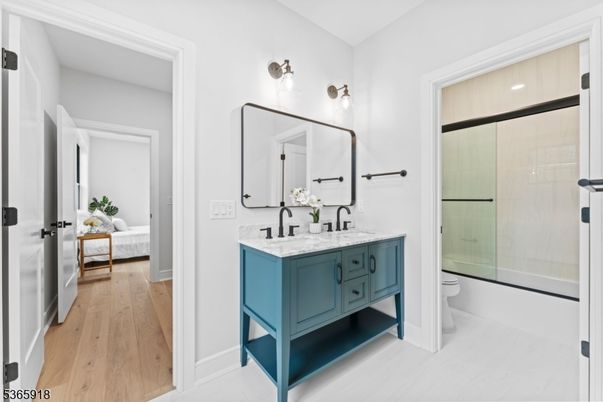 Bathroom, Bedroom, Dual Sink Vanities, Glass Shower, Interior, Wood Texture Flooring