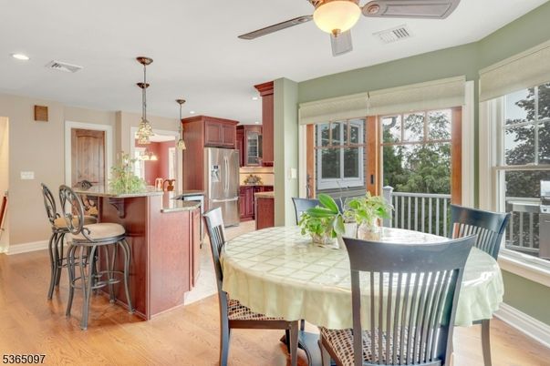 Dining room, Interior, Kitchen, Pendant Lights, Recessed Lighting, Stainless Steel Appliances, Wood Texture Flooring
