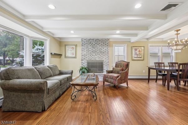 Chandelier, Dining room, Fireplace, Interior, Living room, Recessed Lighting, Stone Walls, Wood Texture Flooring
