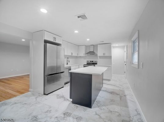 Interior, Kitchen, Marble, Recessed Lighting, Stainless Steel Appliances, Wood Texture Flooring