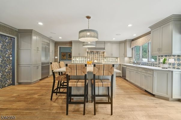 Chandelier, Dining room, Interior, Kitchen, Pendant Lights, Recessed Lighting, Stainless Steel Appliances, Wood Texture Flooring