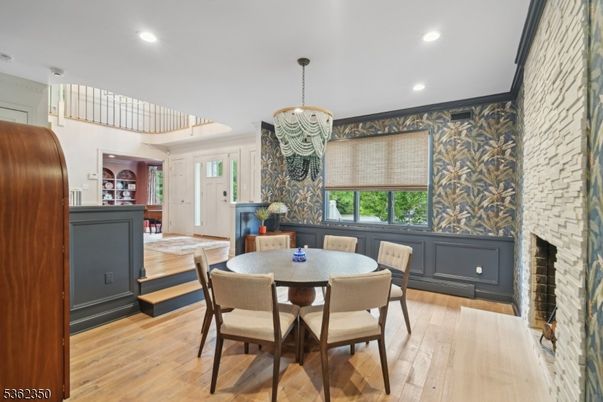 Dining room, Fireplace, Interior, Pendant Lights, Recessed Lighting, Stone Walls, Wood Texture Flooring