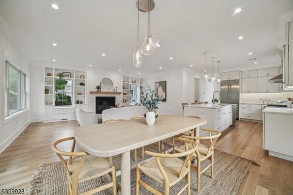 Dining room, Fireplace, Interior, Kitchen, Living room, Pendant Lights, Recessed Lighting, Stainless Steel Appliances, Wood Texture Flooring