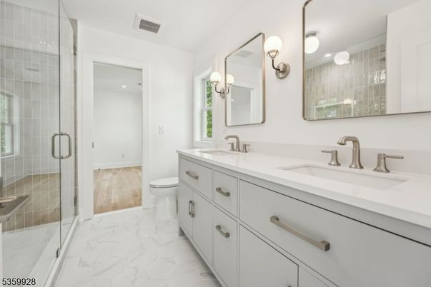 Bathroom, Dual Sink Vanities, Glass Shower, Interior, Marble, Recessed Lighting, Wood Texture Flooring