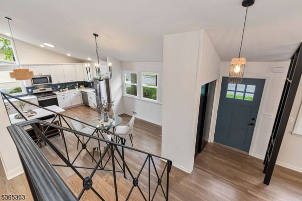 Dining room, Interior, Kitchen, Pendant Lights, Recessed Lighting, Stainless Steel Appliances, Wood Texture Flooring