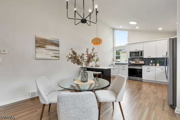 Dining room, Interior, Kitchen, Pendant Lights, Recessed Lighting, Stainless Steel Appliances, Wood Texture Flooring