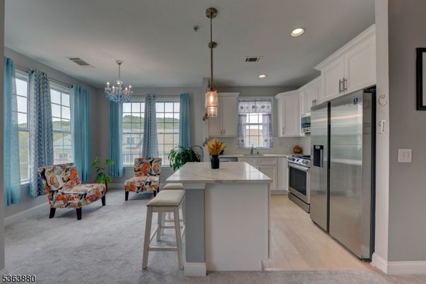 Chandelier, Interior, Kitchen, Pendant Lights, Recessed Lighting, Stainless Steel Appliances, Wood Texture Flooring