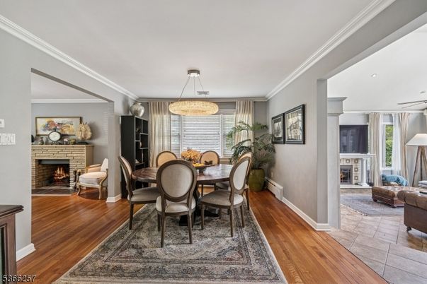 Chandelier, Dining room, Fireplace, Interior, Living room, Pendant Lights, Wood Texture Flooring